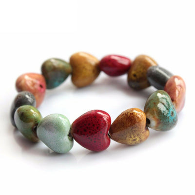 close-up of the Colorful 'His Steadfast Love' Ceramic Heart bead Bracelet on white