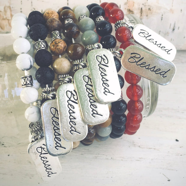 photo of all the Blessed natural stone bracelet variants displayed around a jar
