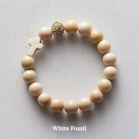 product top-view of the ‘Thou Art With Me’ White Fossil Natural Stone  with Ivory Cross Bead Bracelet