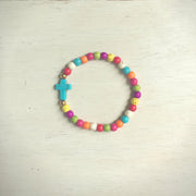 top view of the Colorful ' jesus loves me' Youth bead bracelet with turquoise cross