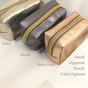 photo of the 3 zippered min-pouch options — Gold, Rose Gold, and Silver