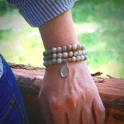 close-up of the Tree of Life Wrap Amazonite Bead Bracelet on Model's wrist