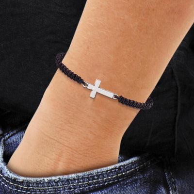 Photo of the black ' I Can Do All Things ' corderd Cross Bracelet on mans wrist