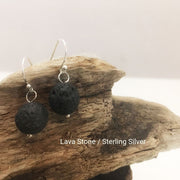 close-up of the Natural Stone Blessing Earrings—Lava Stone bead and Sterling Silver Hook