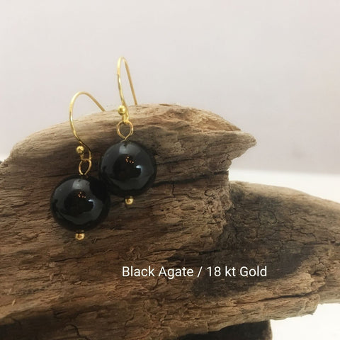 close-up of the Natural Stone Blessing Earrings—Black Agate bead and Sterling Silver Hook plated in 18k gold