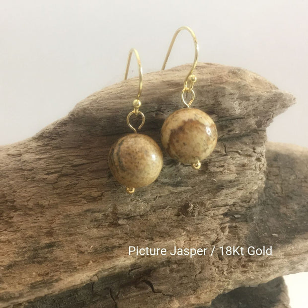 close-up of the Natural Stone Blessing Earrings—Picture Jasper bead and Sterling Silver Hook plated in 18k gold