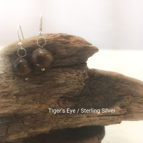 close-up of the  Natural Stone Blessing Earrings—Tiger’s Eye bead and Sterling Silver Hook
