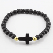 top view of the Black ' jesus loves me' Youth bead bracelet with black cross