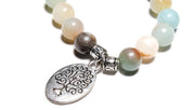 close-up of the Tree of Life Wrap Amazonite Bead Bracelet's Tree of Life round charm