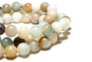 very close-up of the Tree of Life Wrap Amazonite Beads  on white background