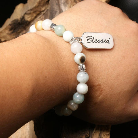 close-up of the blessed bracelt on Models wrist